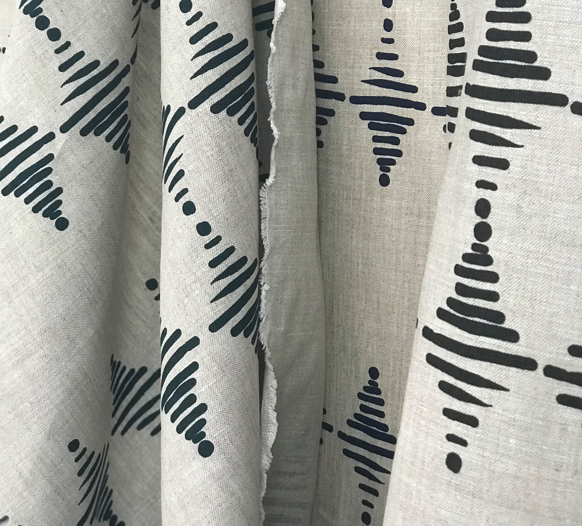 stacked draped pepper and indigo greige textiles