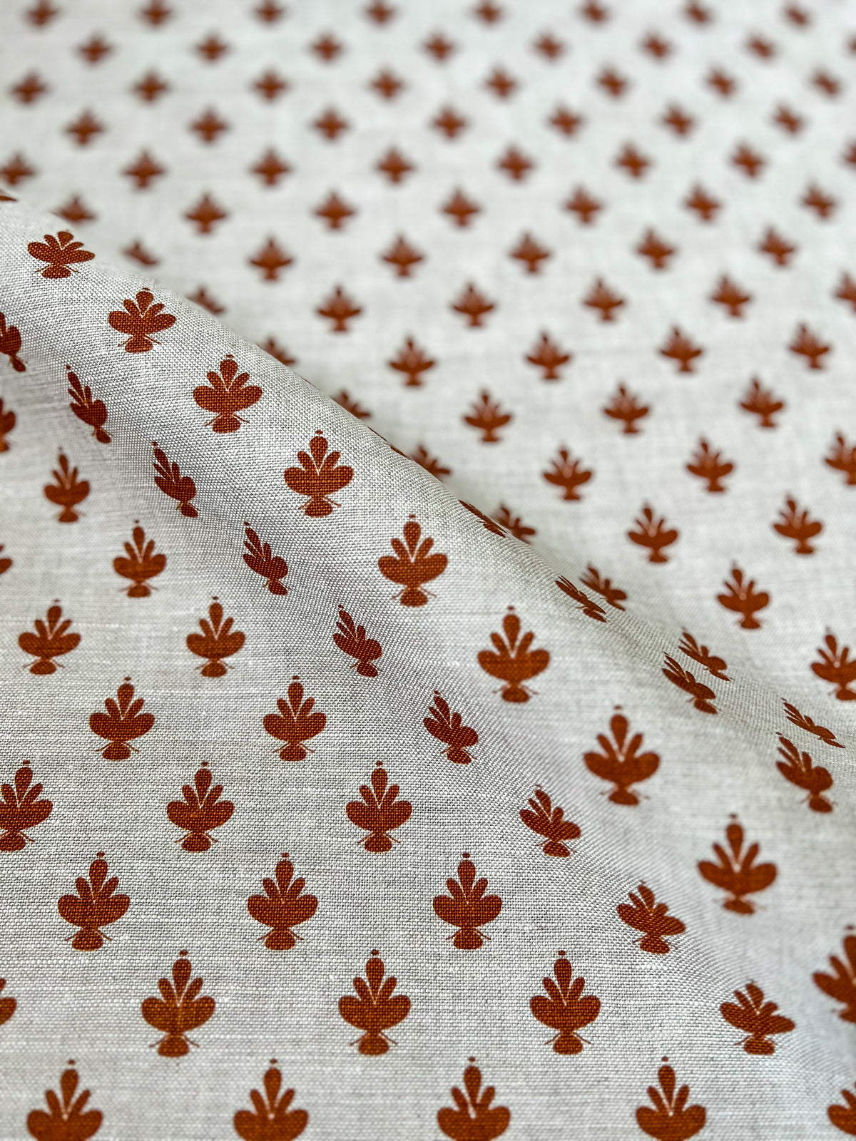 Adeline botanical print by Greige Textiles — inspired by the elegant Jane Magnolia flower, with elliptical curves and soft symmetry on Belgian linen.