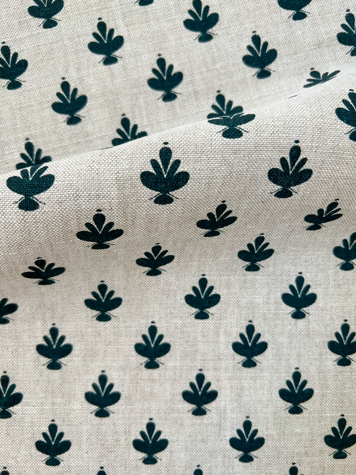 Adeline floral fabric — a refined hand-drawn magnolia design that captures the grace of spring gardens and timeless botanical beauty. Dark Green on natural linen.