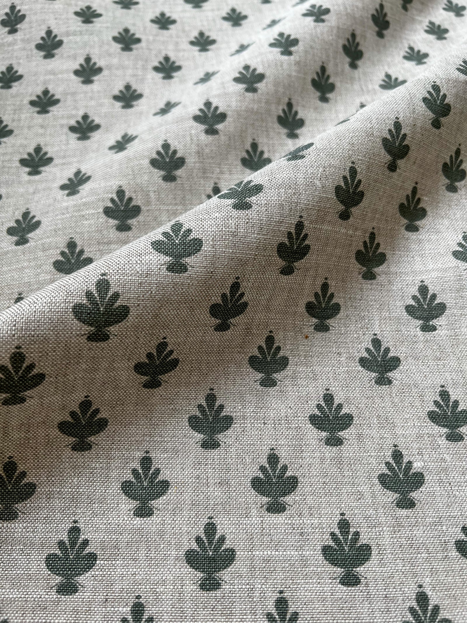 Adeline botanical textile — showcasing Jane Magnolia flowers with graceful detail and soft, symmetrical petals, screen printed on linen. Elevate your home with Greige Textiles' lively collection of hand screen-printed linen fabrics and artisan wallpapers.