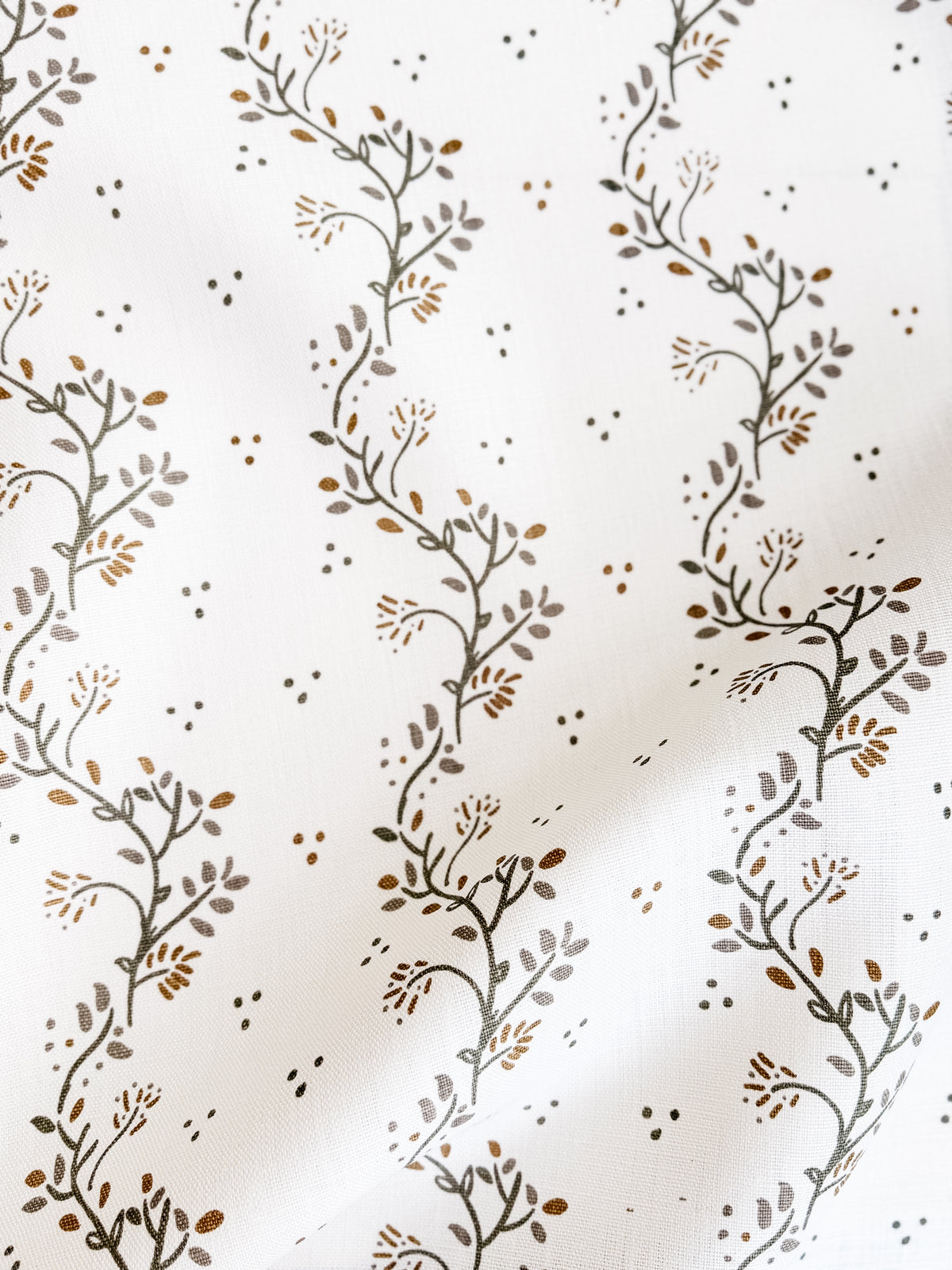 Greige Textiles Collection 12 Arden decorative fabric showcasing elegant vine motifs inspired by clematis growing over aged stone walls