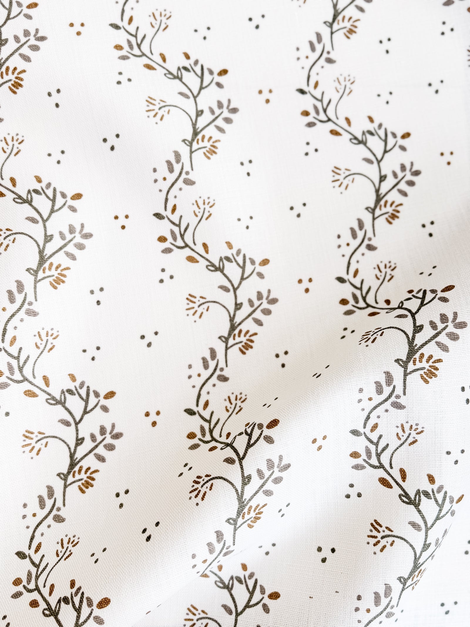 Greige Textiles Collection 12 Arden decorative fabric showcasing elegant vine motifs inspired by clematis growing over aged stone walls