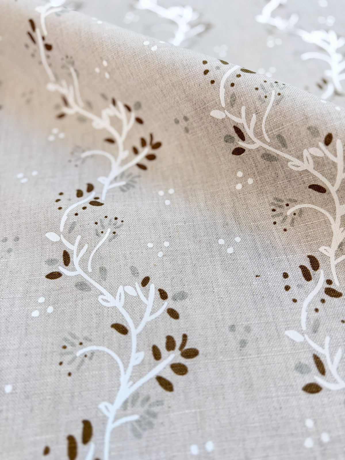 Arden textile by Greige Textiles featuring flowing botanical clematis vines with soft organic movement and natural garden inspiration