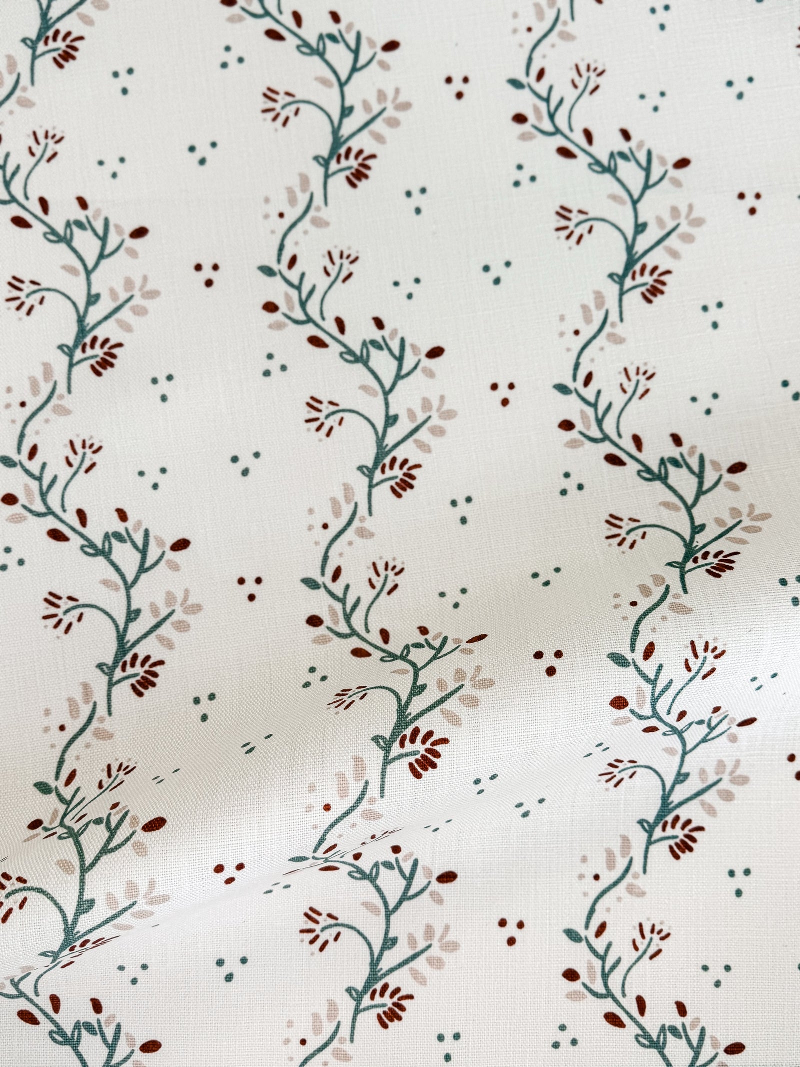 New heritage fabric patterns, hand screen printed on linen by Greige Textiles. Discover more for your next interior project. Arden by Greige Textiles, a botanical textile design with trailing clematis vines and organic nature-inspired movement