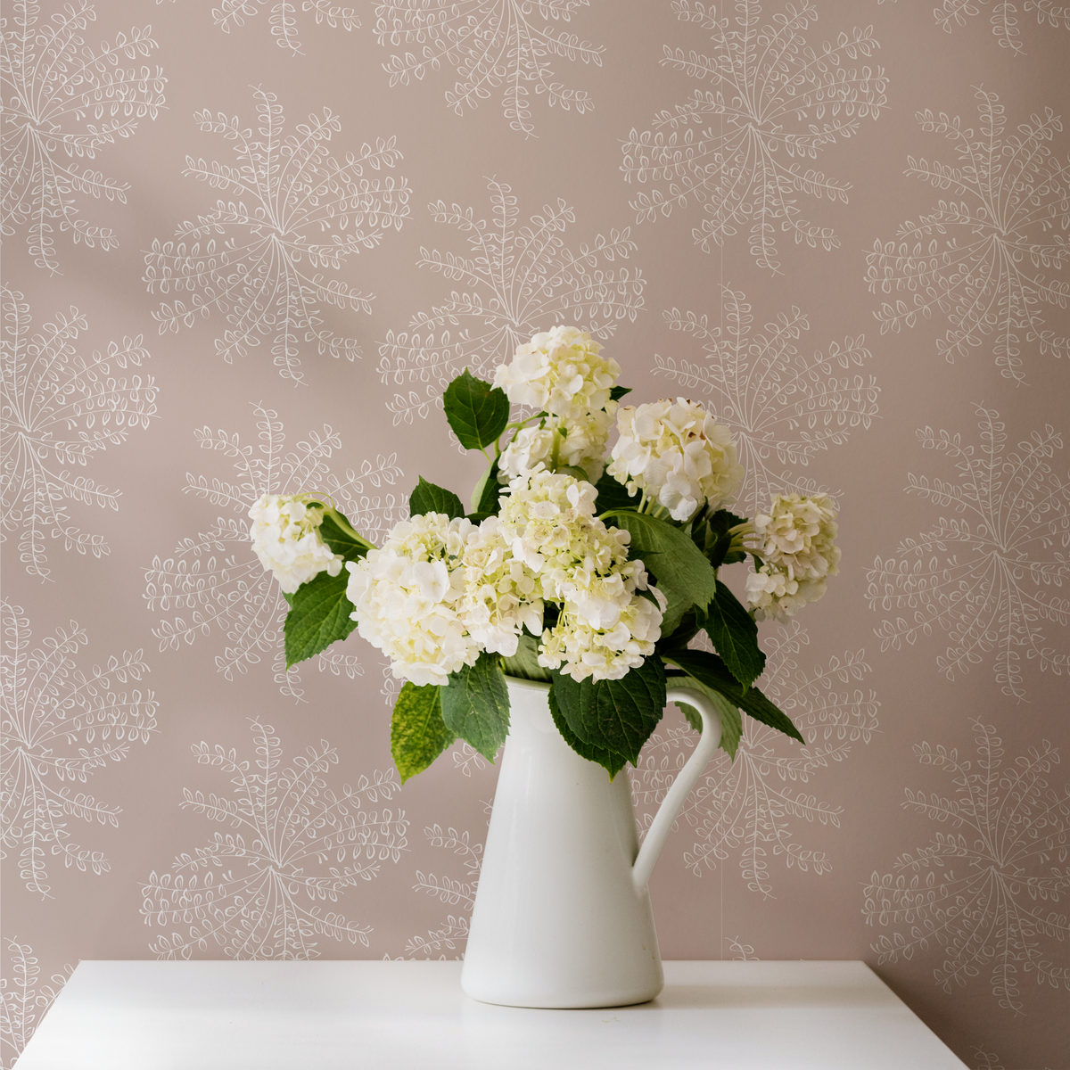 Ashby wallpaper — a botanical floral design reminiscent of untamed wildflower bouquets, available in soft, adaptable colorways.