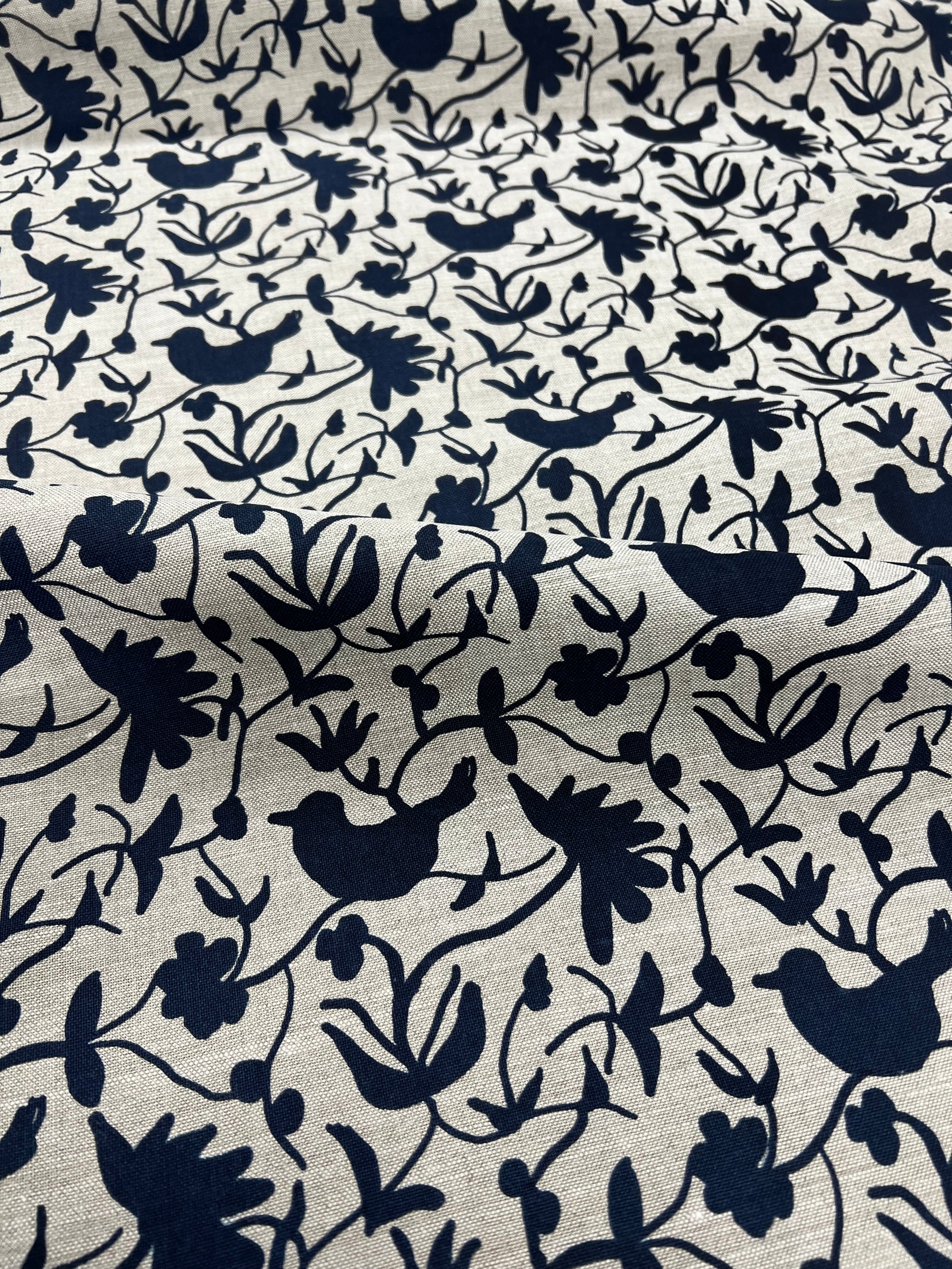 Greige Textiles’ Eliza pattern — an expressive floral and bird motif, screen printed on natural Belgian linen for timeless appeal. Blue on Linen.