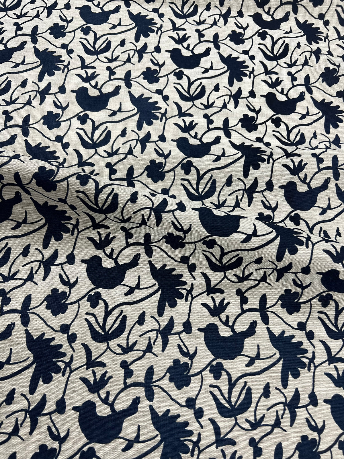 Greige Textiles’ Eliza pattern — an expressive floral and bird motif, screen printed on natural Belgian linen for timeless appeal.