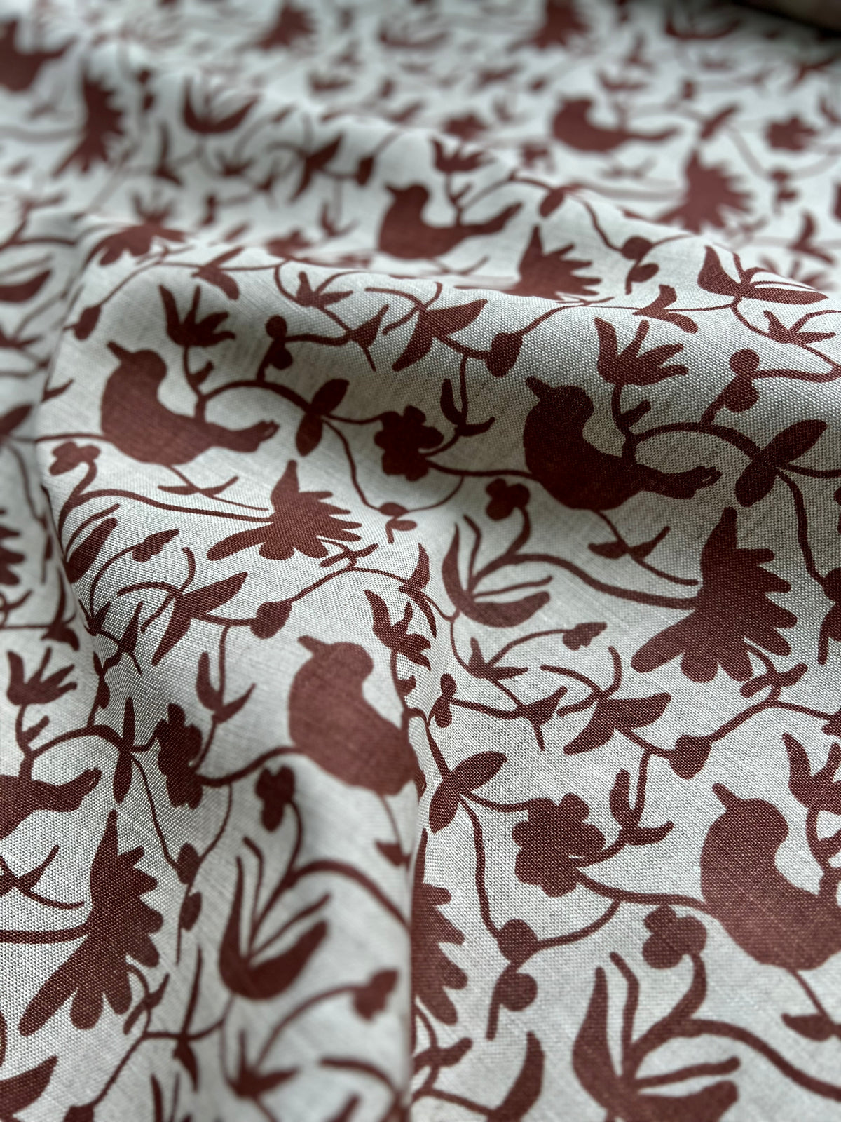 Hand-printed Eliza design — featuring a whimsical mix of birds and botanical forms, created for refined, nature-rich interiors.