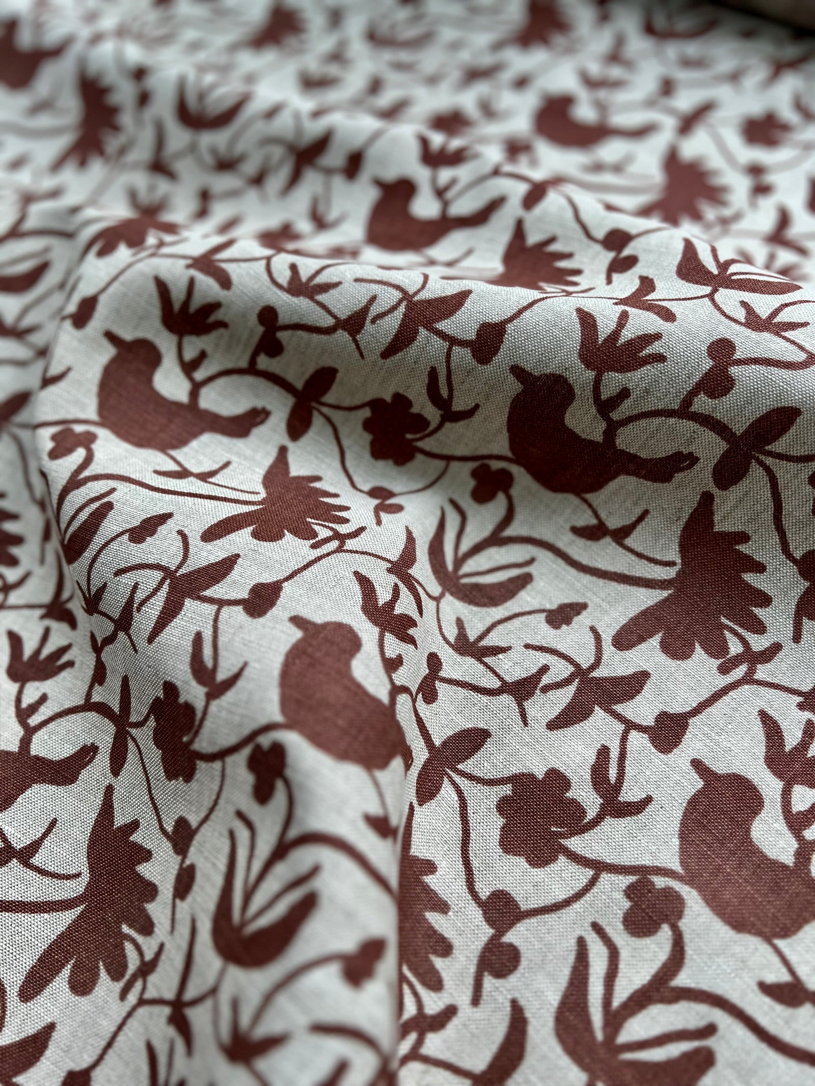 Hand-printed Eliza design — featuring a whimsical mix of birds and botanical forms, created for refined, nature-rich interiors.