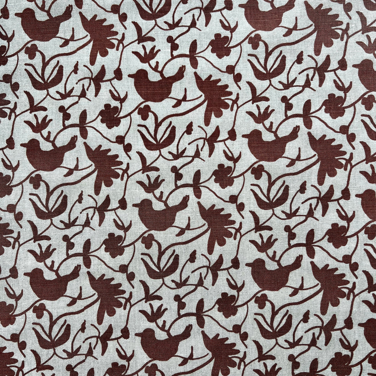 Hand-printed Eliza design — featuring a whimsical mix of birds and botanical forms, created for refined, nature-rich interiors.