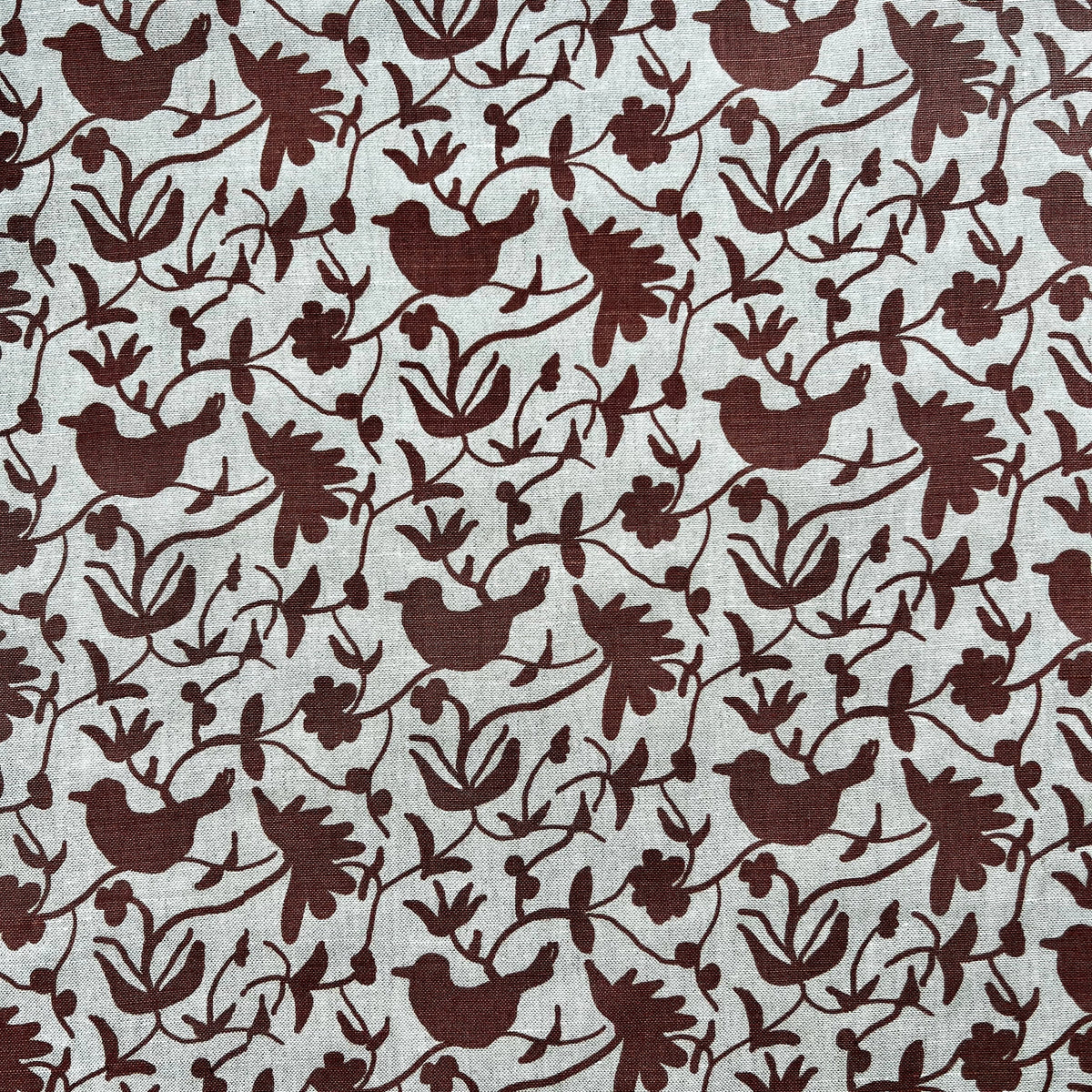Eliza pattern by Greige Textiles — a hand-drawn botanical design featuring stylized florals and birds, printed on Belgian linen. Pink on natural linen