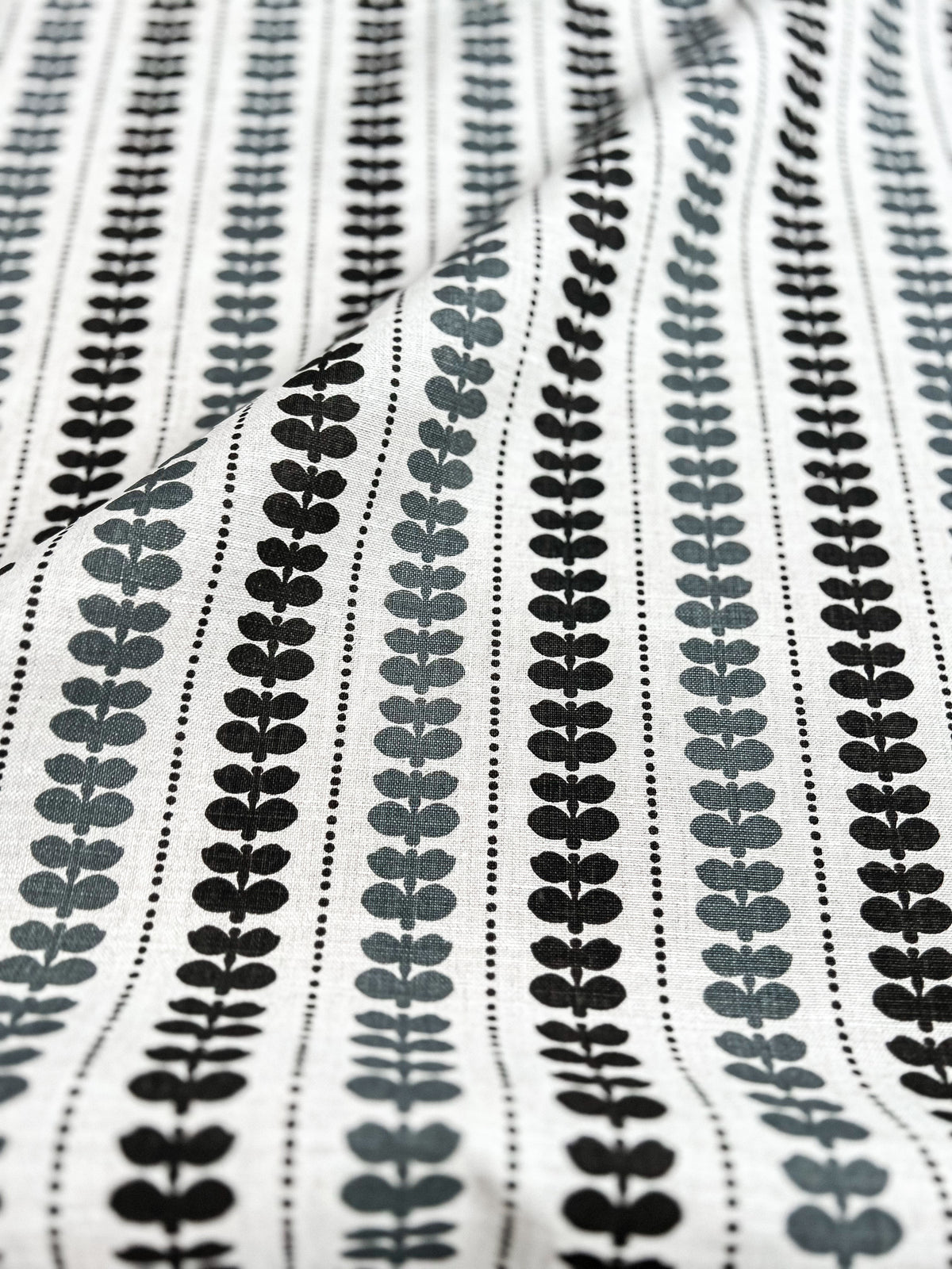 Elodie pattern by Greige Textiles — a hand-drawn floral stripe printed on Belgian linen, offering a modern take on a classic motif. Azure and Pepper on Oatmeal