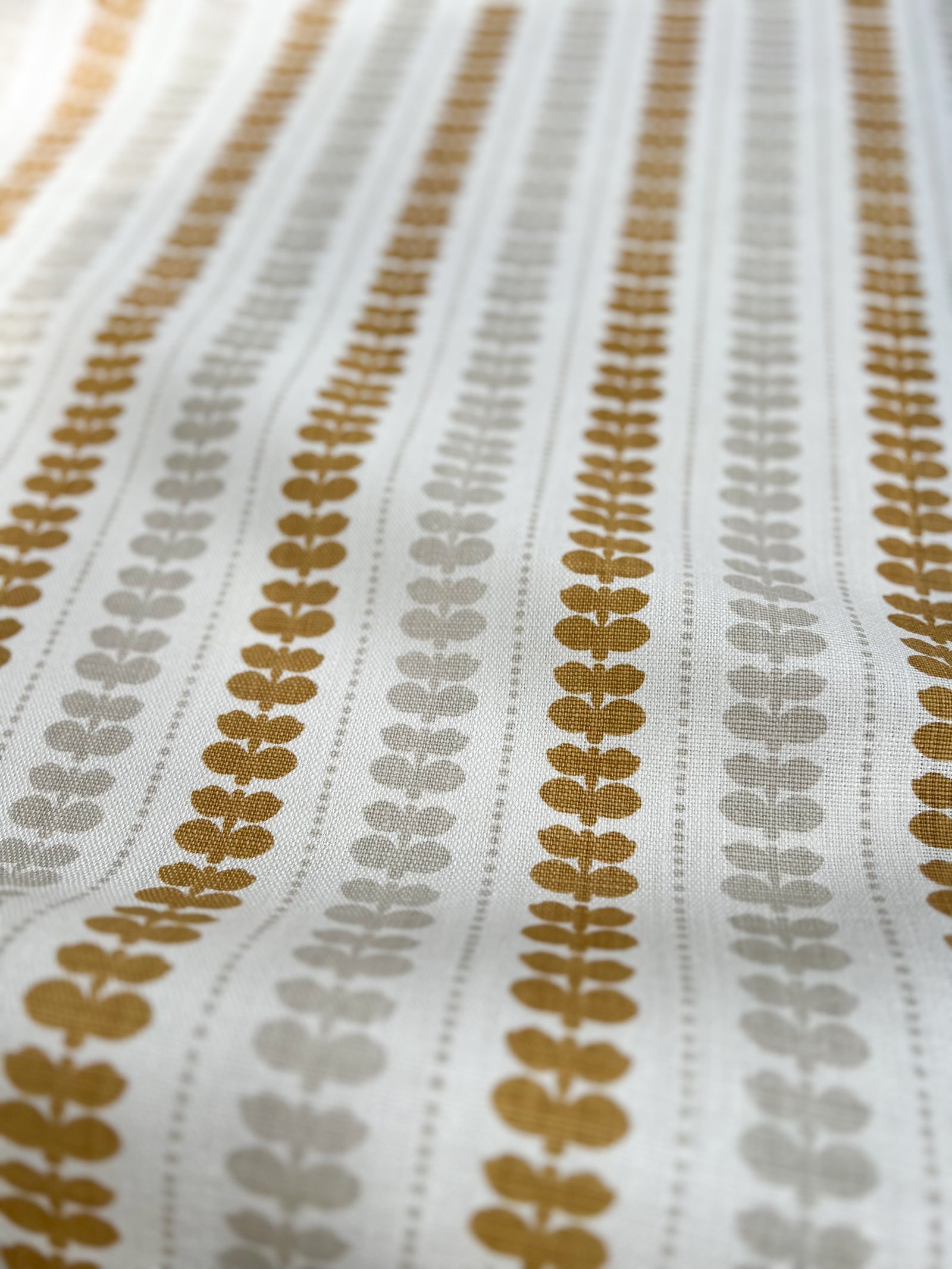 Artisan screen-printed linen with Elodie’s floral stripe design — delicate botanical elements arranged in a subtle, repeating rhythm. Wheat and Heron on Oyster