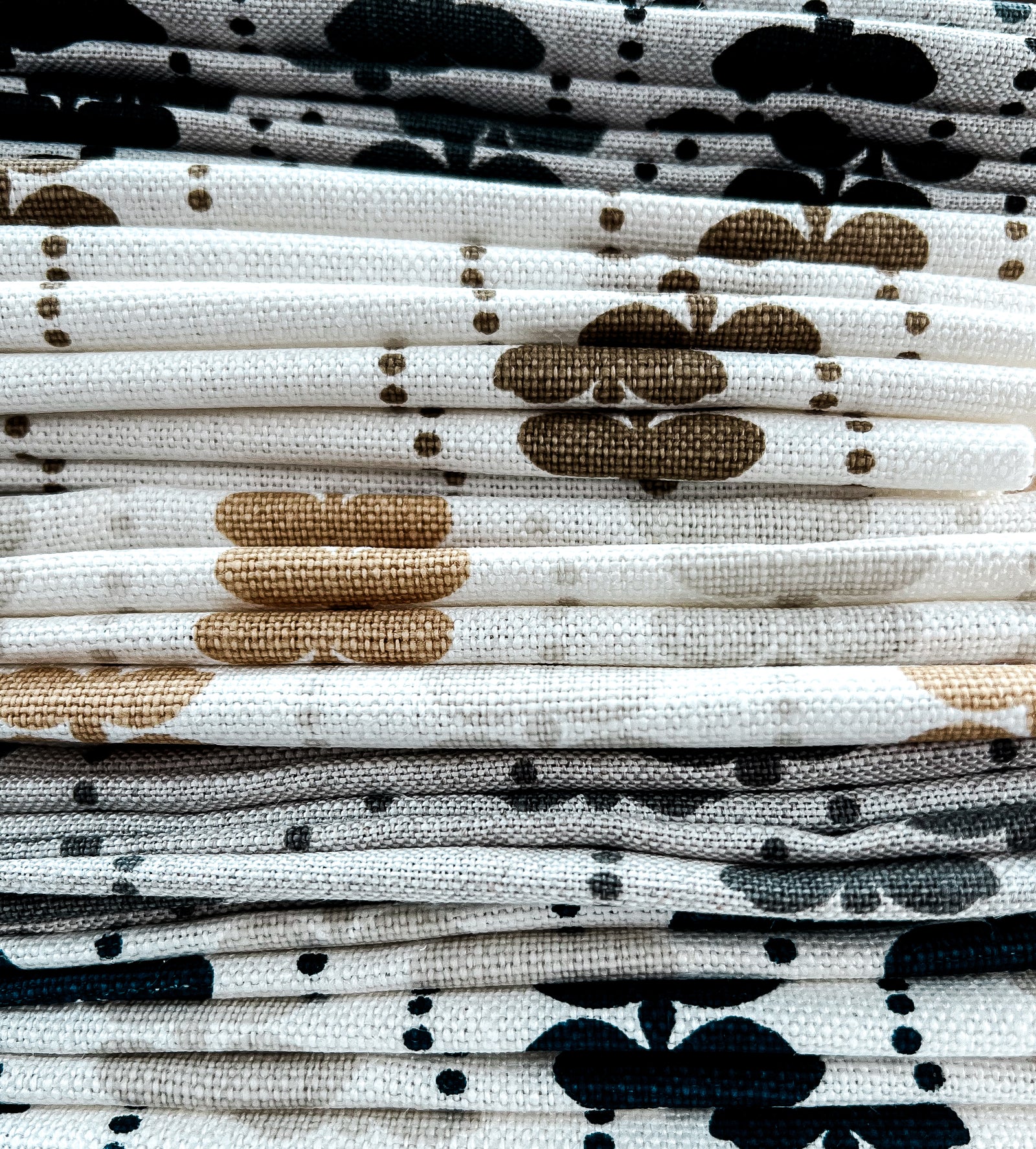 Artisan screen-printed linen with Elodie’s floral stripe design — delicate botanical elements arranged in a subtle, repeating rhythm.