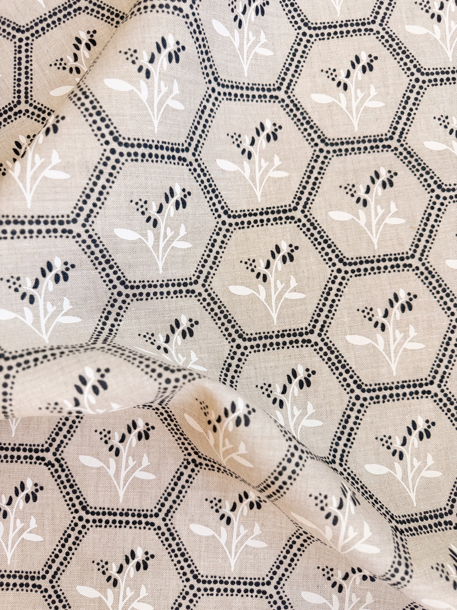 Collection 12 Enid by Greige Textiles, a timeless textile design blending geometric honeycomb structure with delicate botanical blooms