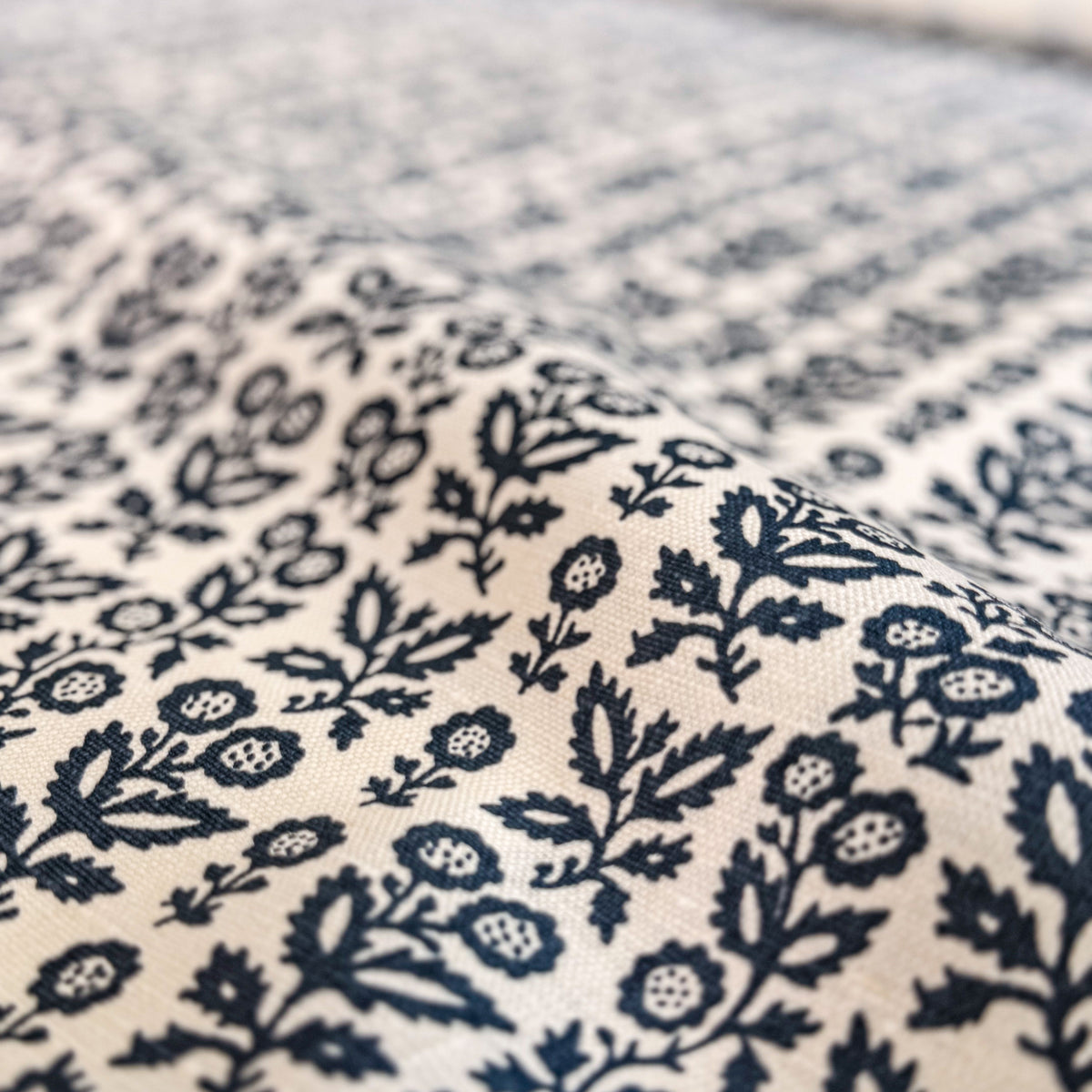 Clementine by  Greige Textiles￼ features a delicate, vintage-inspired pattern drawn from the cover of a rare book discovered along Portobello Road. Its refined composition evokes understated history and heirloom charm, bringing layered character and quiet elegance to drapery, upholstery, and thoughtfully designed interiors. Explore the full collection online.