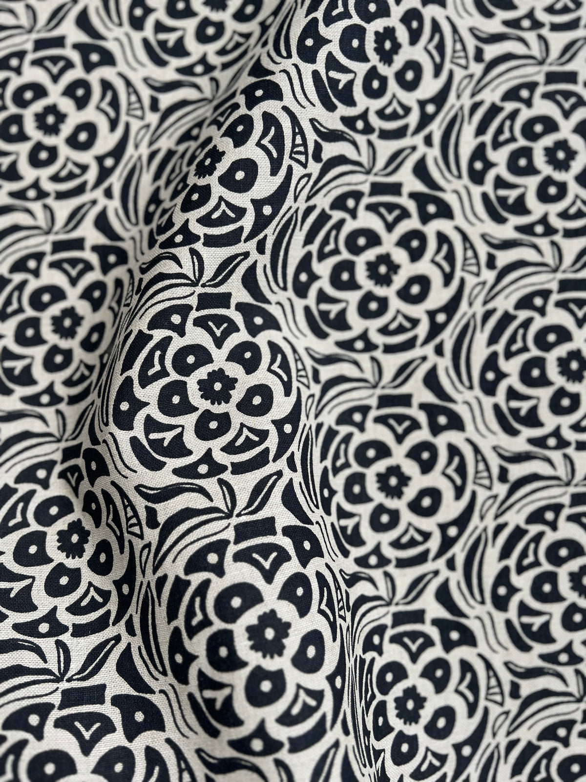 Artisan screen-printed linen showcasing the Ida motif — subtle botanical texture perfect for upholstery, drapery, or custom pillows. Indigo on natural linen