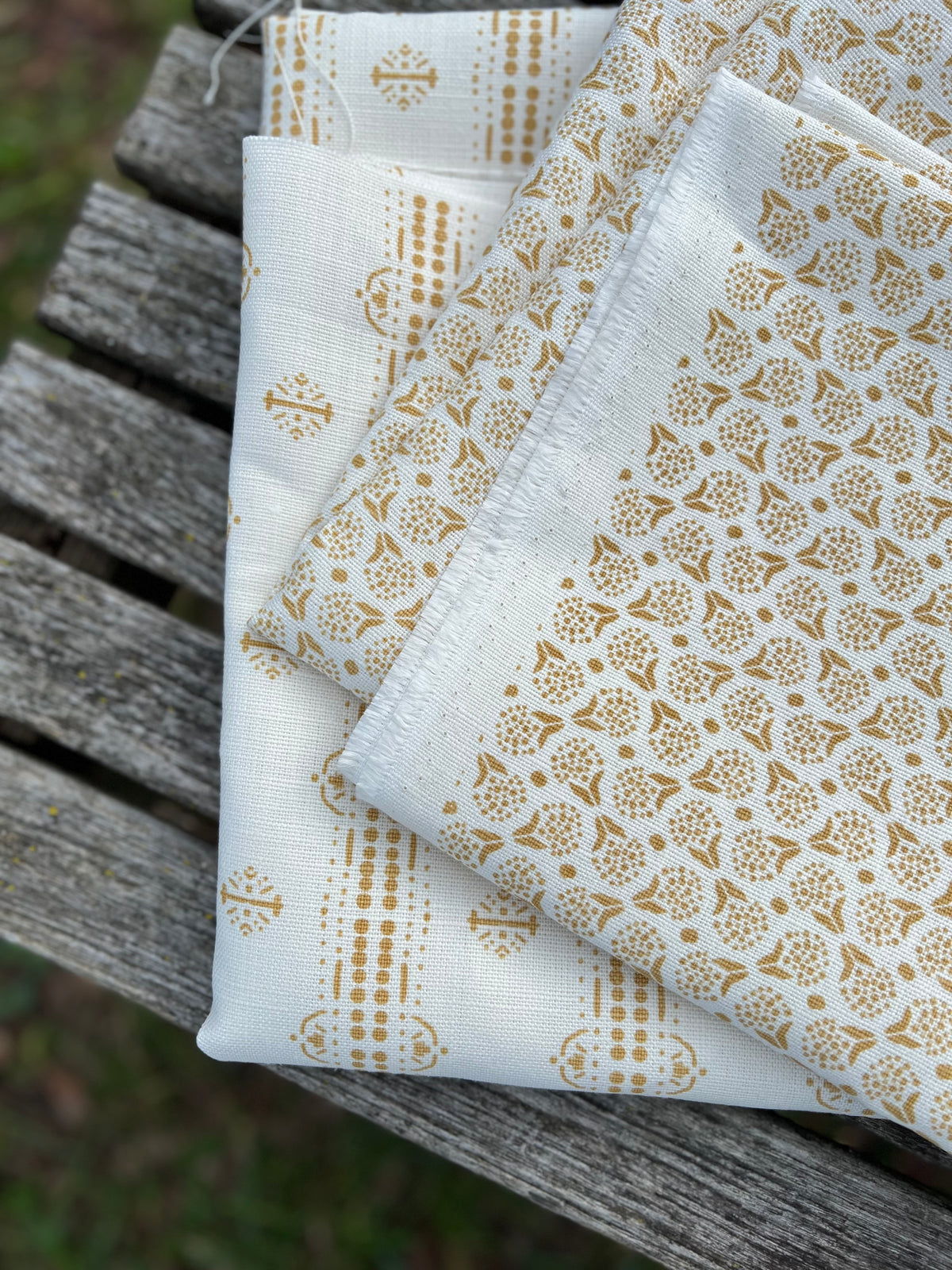 Botanical-inspired fabric in a soft floral dot motif, screen printed on artisanal linen for designer use greige textiles wheat yellow 