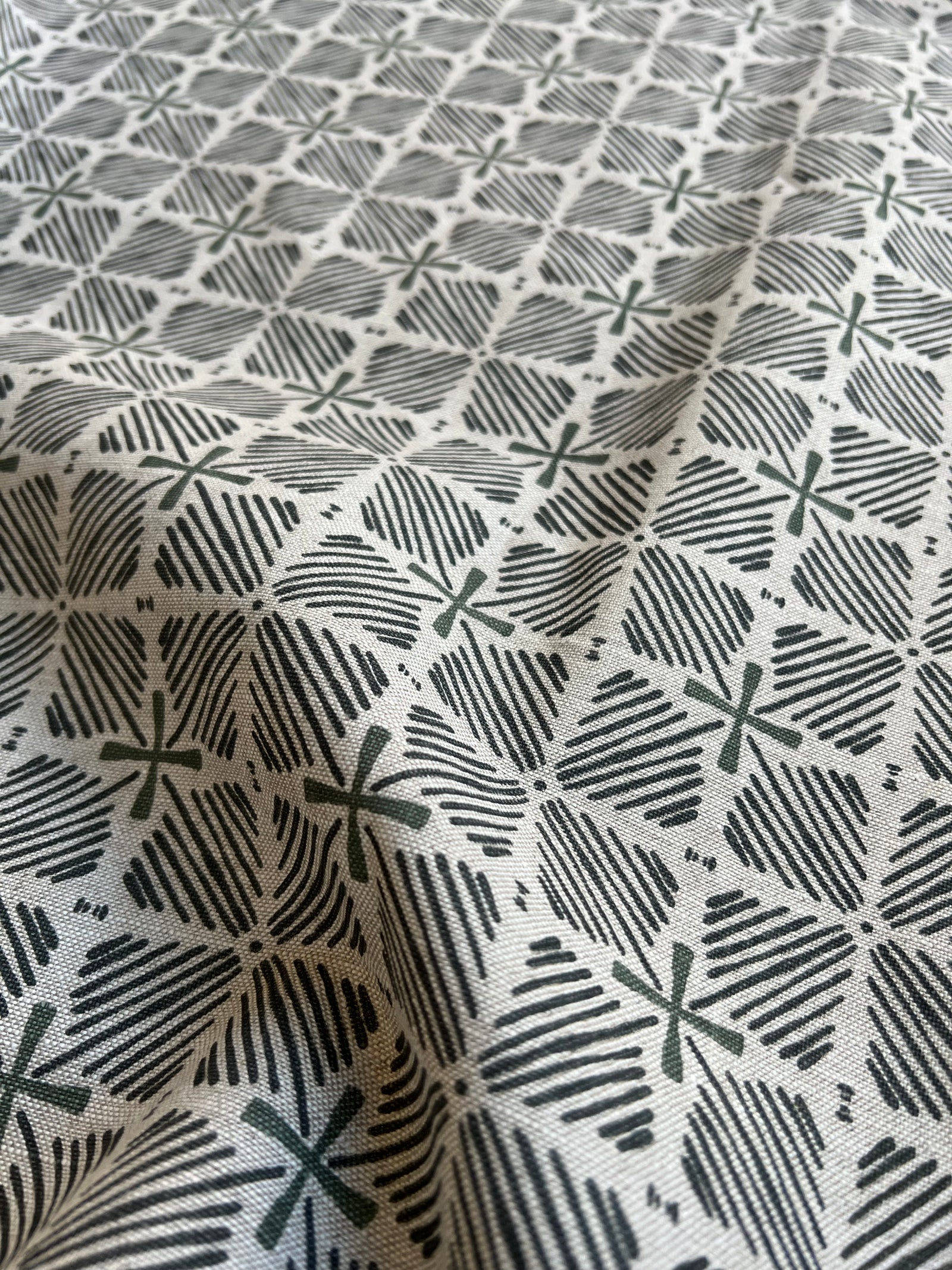 Greige Textiles blends bold color and heritage design in hand-printed linen fabrics and wallpapers—crafted for thoughtful interiors.