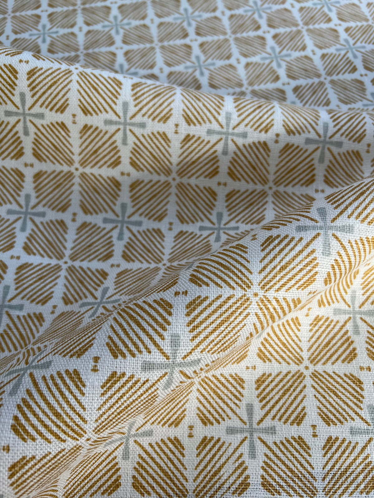 Greige Textiles blends bold color and heritage design in hand-printed linen fabrics and wallpapers—crafted for thoughtful interiors.