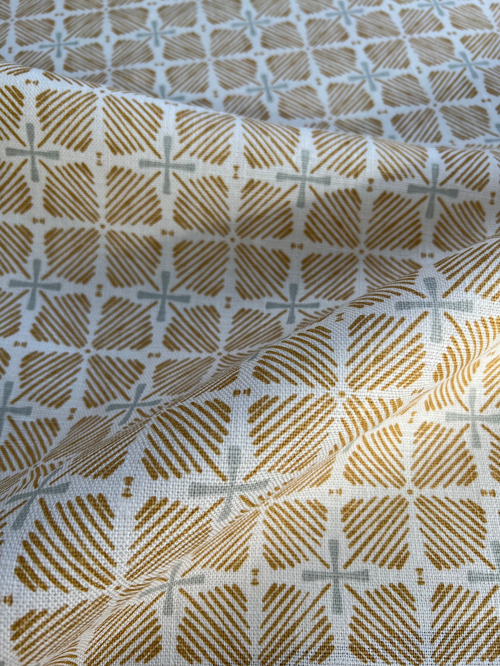 Greige Textiles blends bold color and heritage design in hand-printed linen fabrics and wallpapers—crafted for thoughtful interiors.