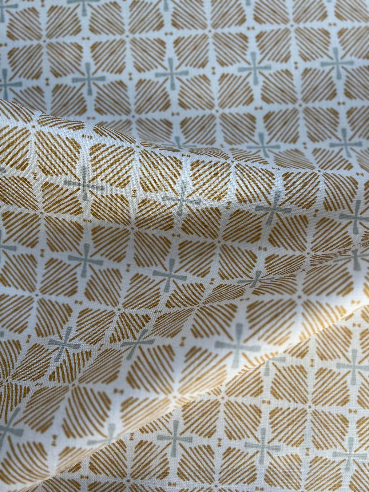 Greige Textiles blends bold color and heritage design in hand-printed linen fabrics and wallpapers—crafted for thoughtful interiors.