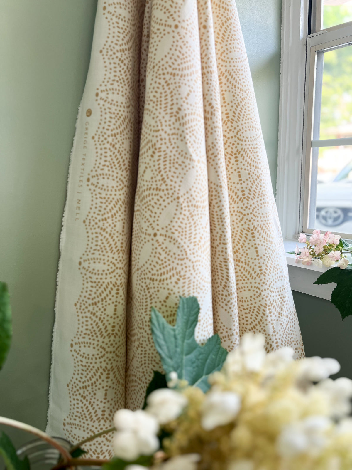 Nell by Greige Textiles offers a flowing, light-filtering pattern for custom drapery—evoking spring foliage and soft sunlight for refined window treatments
