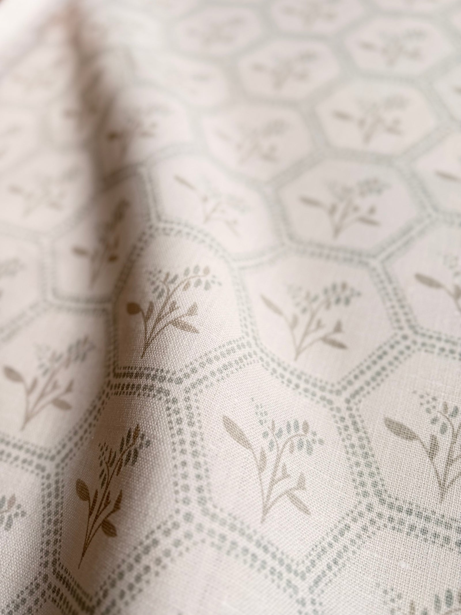 Greige Textiles Enid pattern from Collection 12 combining an elegant honeycomb design with delicate Astrantia flowers