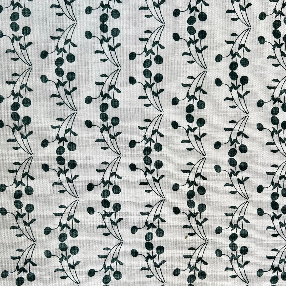 Bernadette pattern — featuring fruit tree motifs hand-printed on Belgian linen, this fabric is designed for timeless interiors and can be used across drapery, soft furnishings, and upholstery.