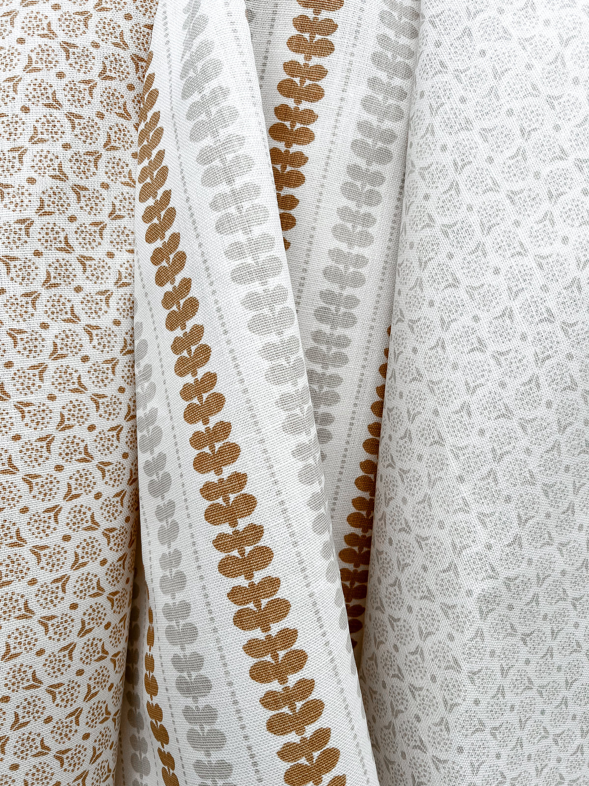 Shop Greige Textiles’ hand screen-printed linens and wallpapers—perfect for bespoke interior design projects.