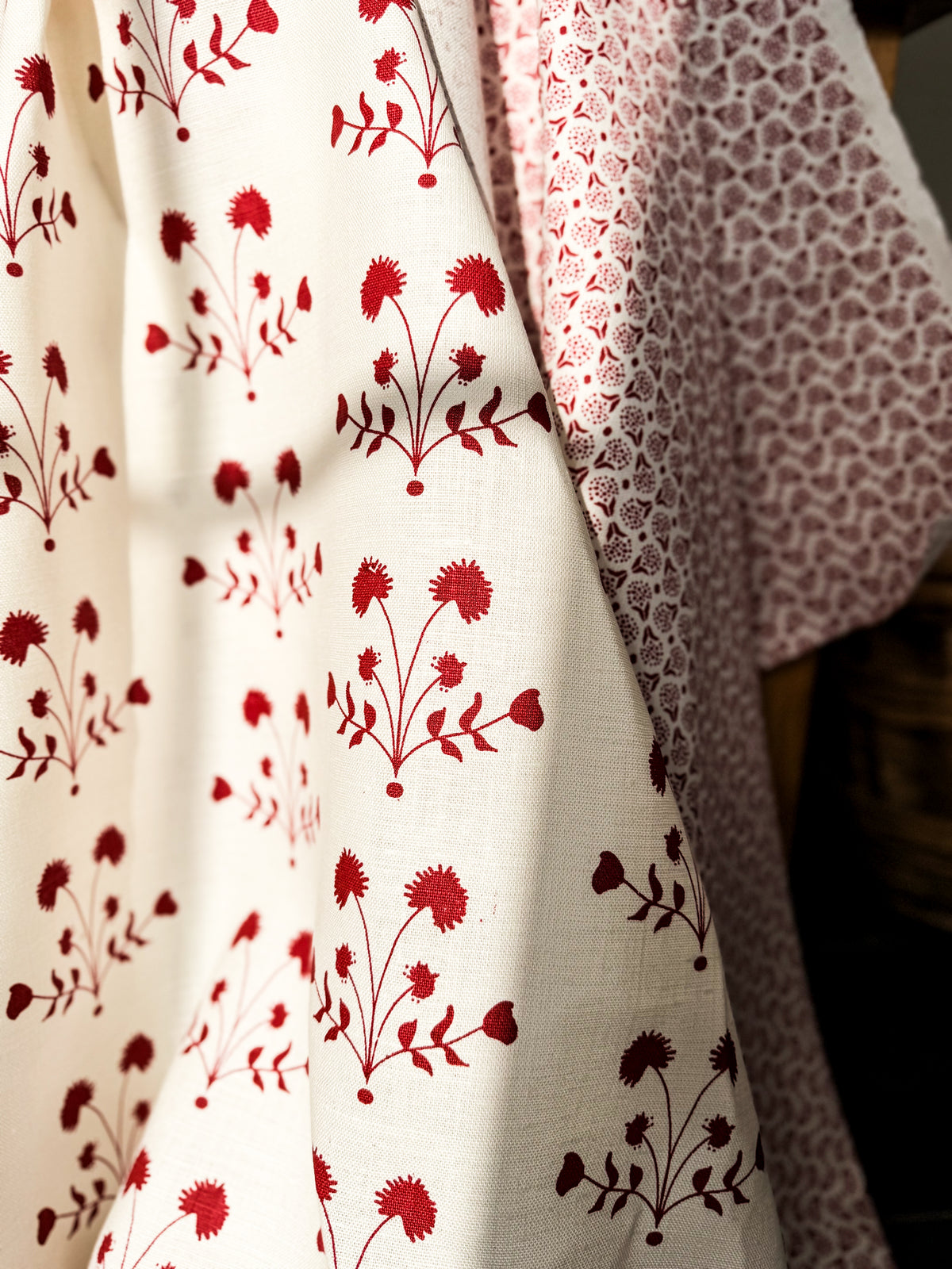 greige textiles lisbet Red on Oyster.  Add depth and character to your home with Greige Textiles’ playful yet timeless designs screen printed by hand on natural linen.