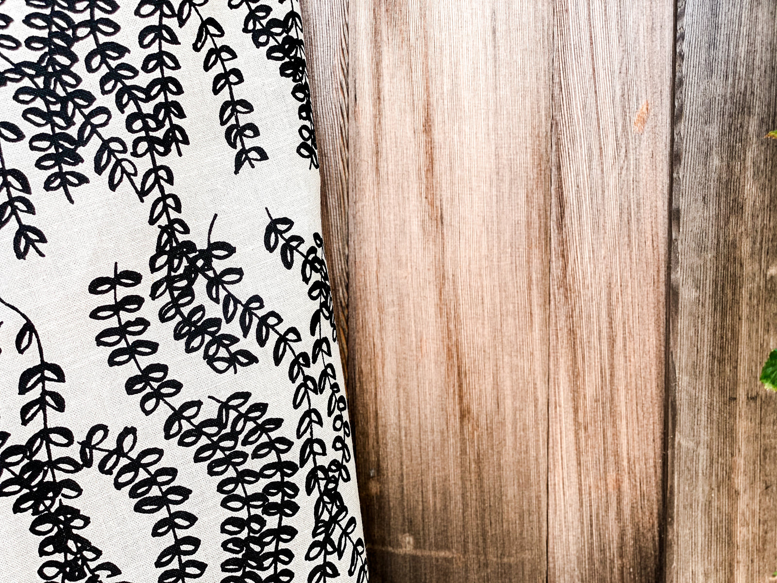 Trailing floral botanical design in Antoinette — hand-drawn and hand-printed on Belgian linen, reflecting natural abundance and thoughtful craftsmanship