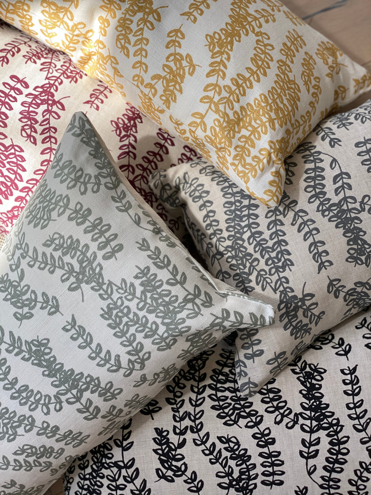 Greige Textiles’ Antoinette — a soft, botanical print with flowing floral vines, hand-printed on artisan Belgian linen for timeless interior applications.