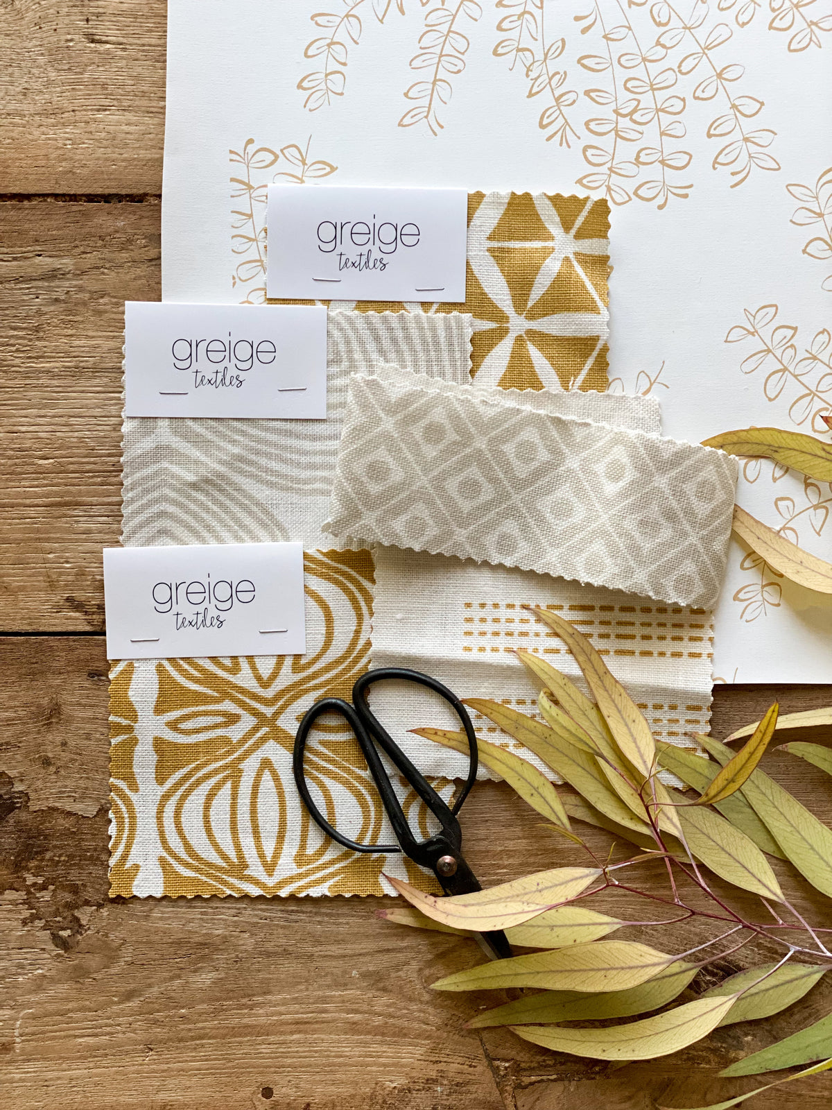 Ashby wallpaper — a botanical floral design reminiscent of untamed wildflower bouquets, available in soft, adaptable colorways.