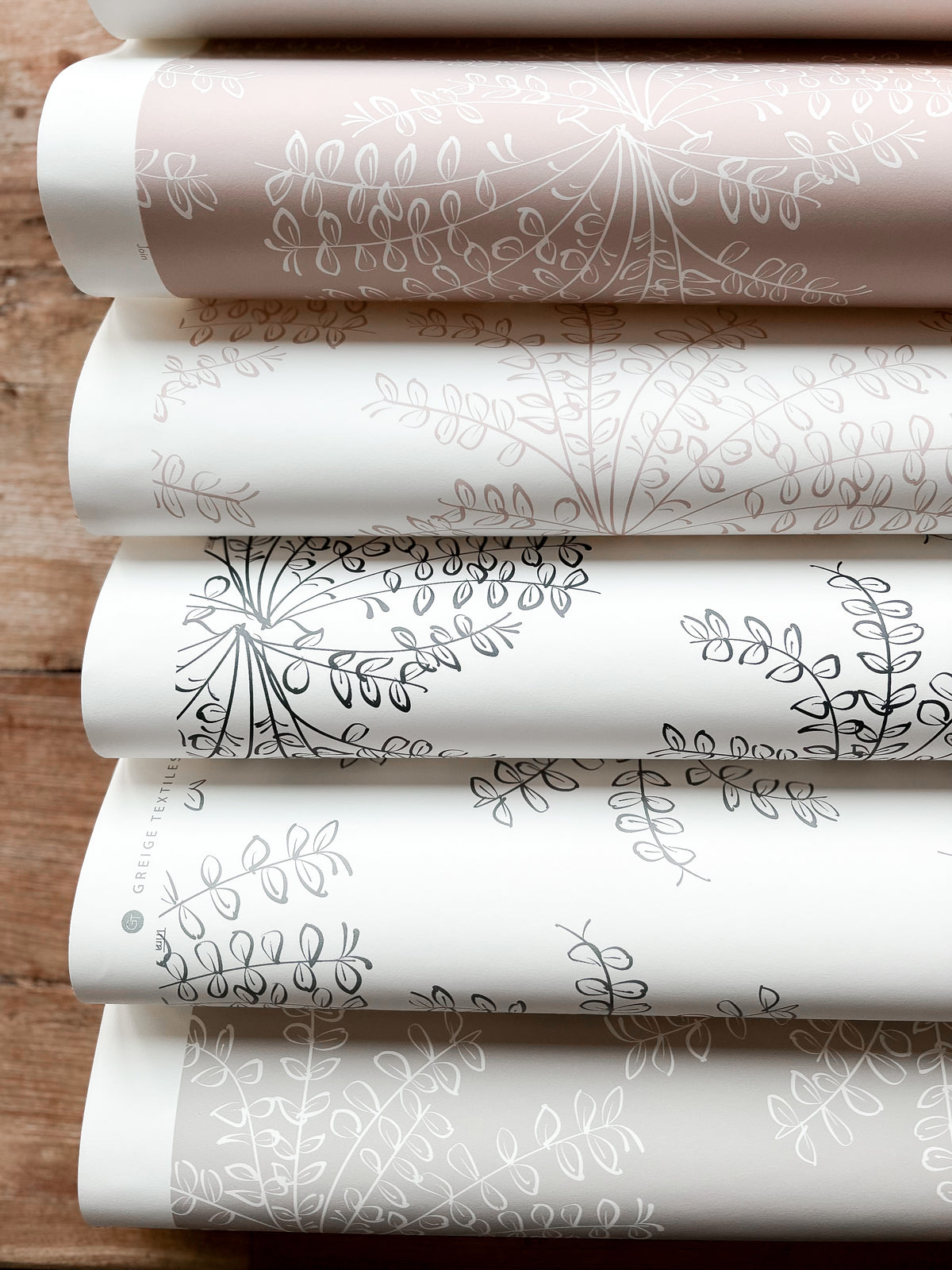 Ashby floral wallpaper by Greige Textiles — a hand-drawn pattern inspired by spring wildflowers, printed on smooth clay-coated paper for elevated interiors.