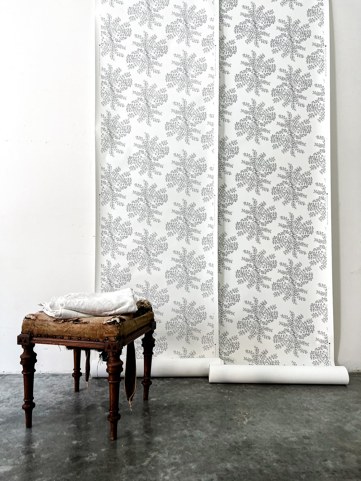 Ashby floral wallpaper by Greige Textiles — a hand-drawn pattern inspired by spring wildflowers, printed on smooth clay-coated paper for elevated interiors.