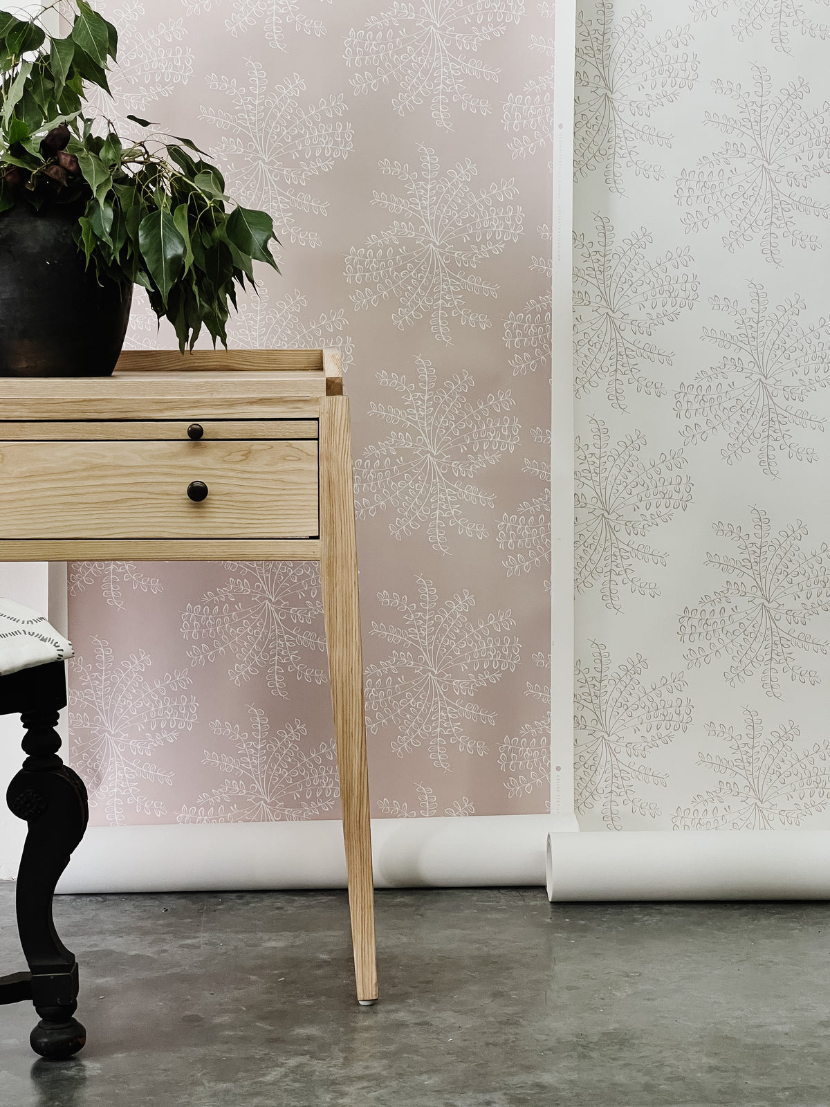 Ashby wallpaper — a botanical floral design reminiscent of untamed wildflower bouquets, available in soft, adaptable colorways.