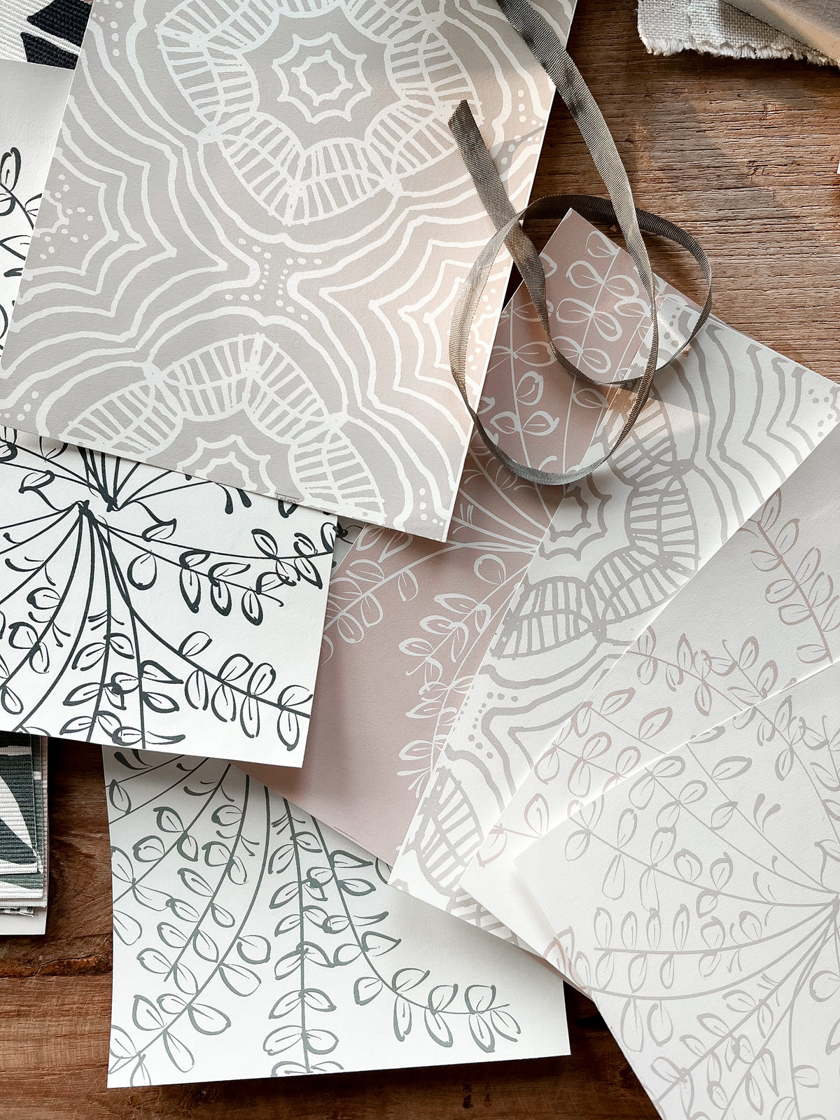 Ashby pattern — delicate wildflower-inspired wallpaper with organic linework, designed by Greige Textiles for a nature-infused interior statement.