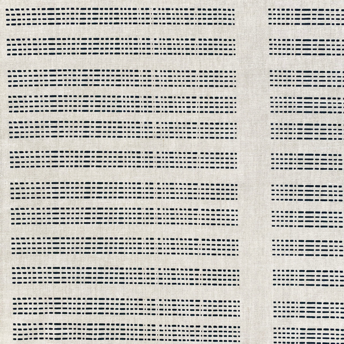 Barre by Greige Textiles — a hand-screen printed linen fabric featuring bold, architectural stripe lines inspired by the fencing at Hotel San Cristóbal.