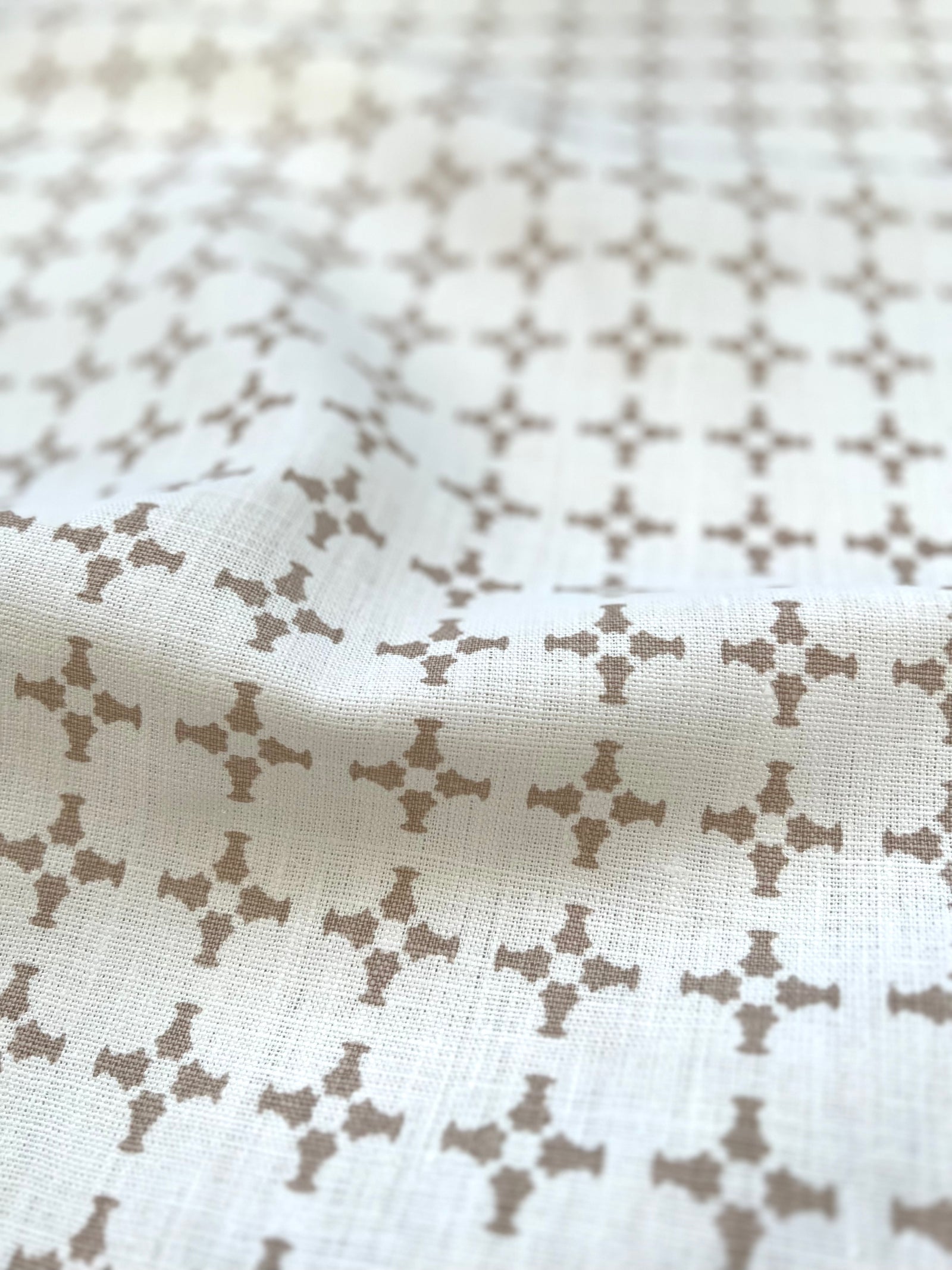Hand-printed CanCan textile by Greige — featuring architectural cross forms for refined interiors, well-suited for drapery, soft furnishings, and upholstery projects.