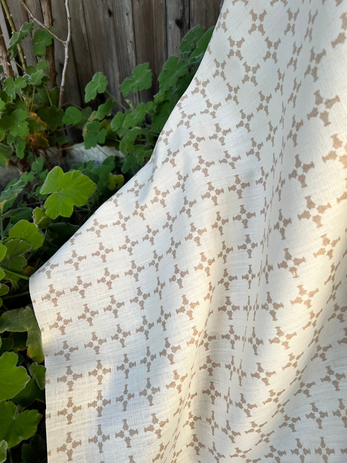 Hand-printed CanCan textile by Greige — featuring architectural cross forms for refined interiors, well-suited for drapery, soft furnishings, and upholstery projects.