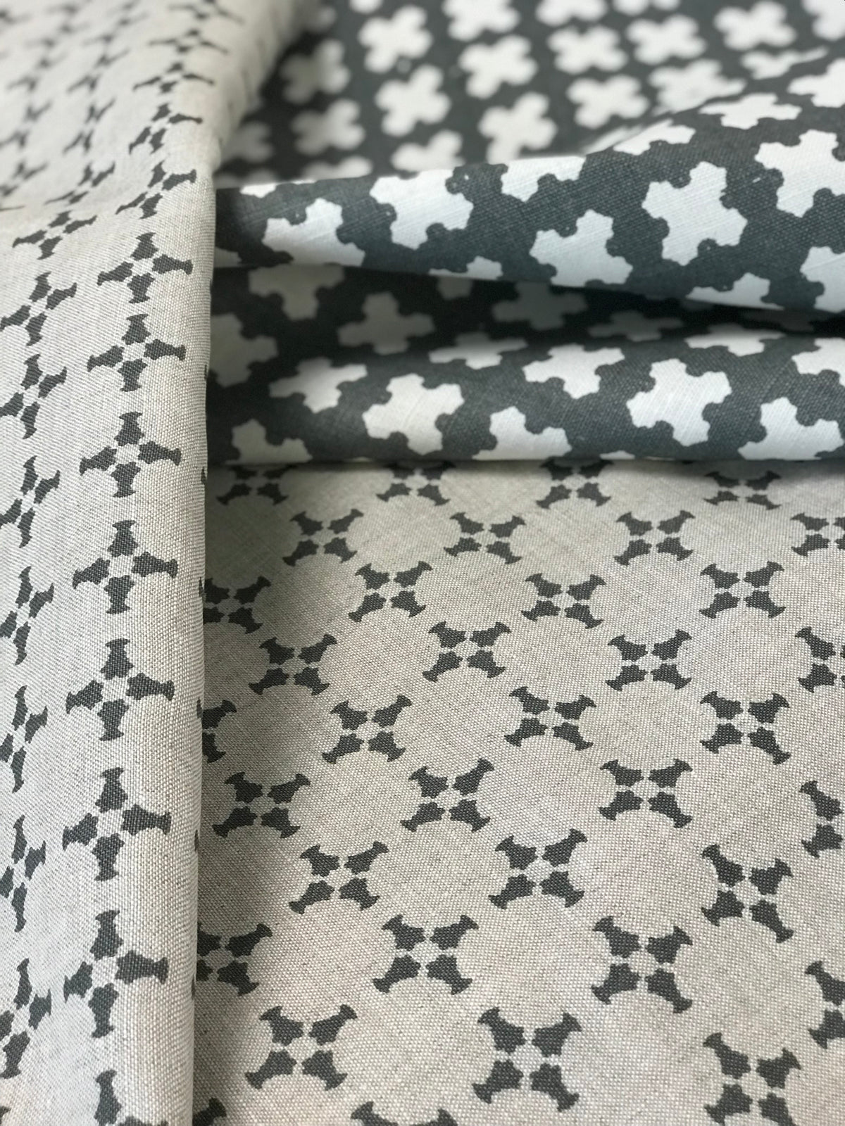 CanCan fabric — inspired by the geometry of brick edging, this open plaid pattern is hand-printed and ideal for bringing structure and subtle pattern to interior design schemes.