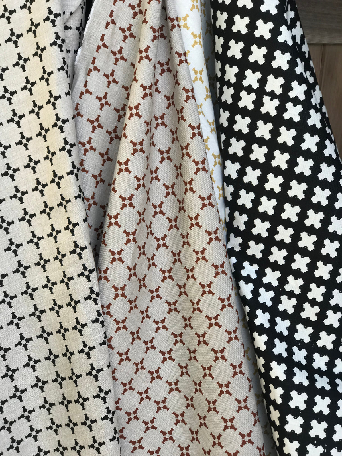 CanCan by Greige Textiles — a hand-printed open plaid design featuring subtle cross motifs, ideal for interior design applications like drapery, decorative pillows, and light upholstery.