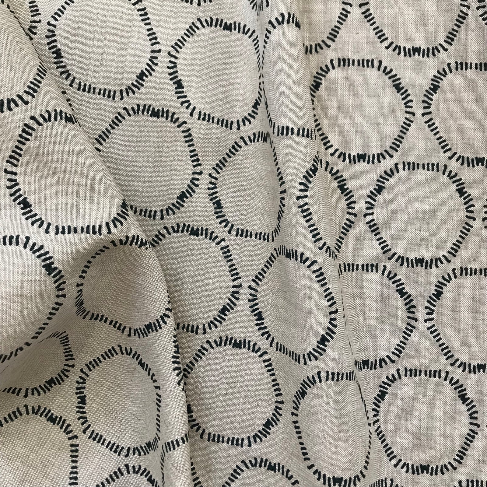 Cape fabric — features soft, freeform circular motifs hand screen printed in California, designed for the interior design trade and perfect for layered, natural interiors.