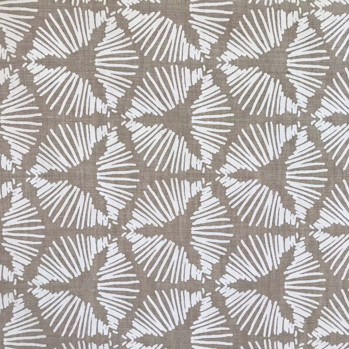The Cie pattern radiates striking visual rhythm with its bold starburst shield design. A dynamic textile hand printed on Belgian linen, ideal for upholstery, cushions, and drapery in spaces that embrace graphic elegance.