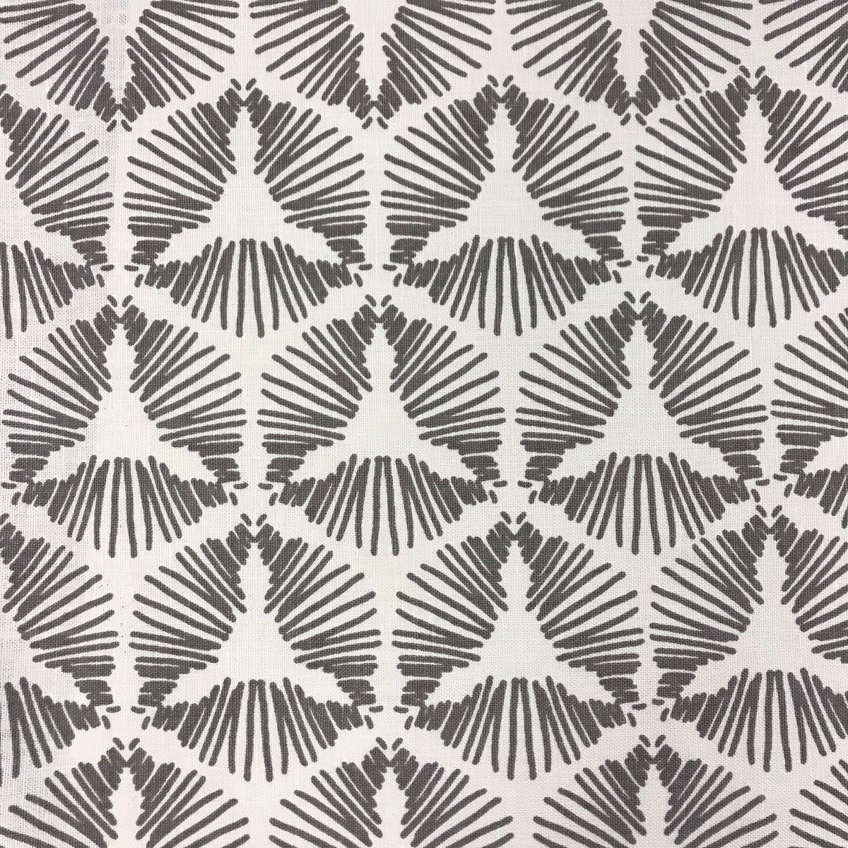 Cie – where geometry meets excitement. A bold starburst shield pattern printed on luxurious Belgian linen, designed to bring theatrical flair and flow to interior spaces.&quot;