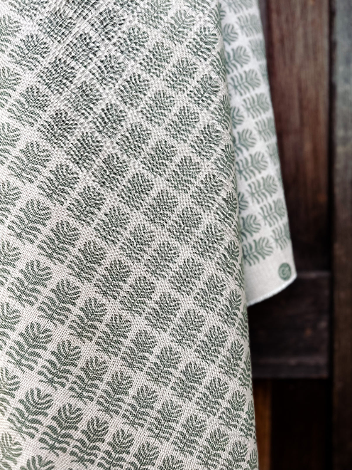 Greige Textiles Clara fabric — a light, botanical floral motif with heritage influences, hand-printed on Belgian linen for timeless interiors