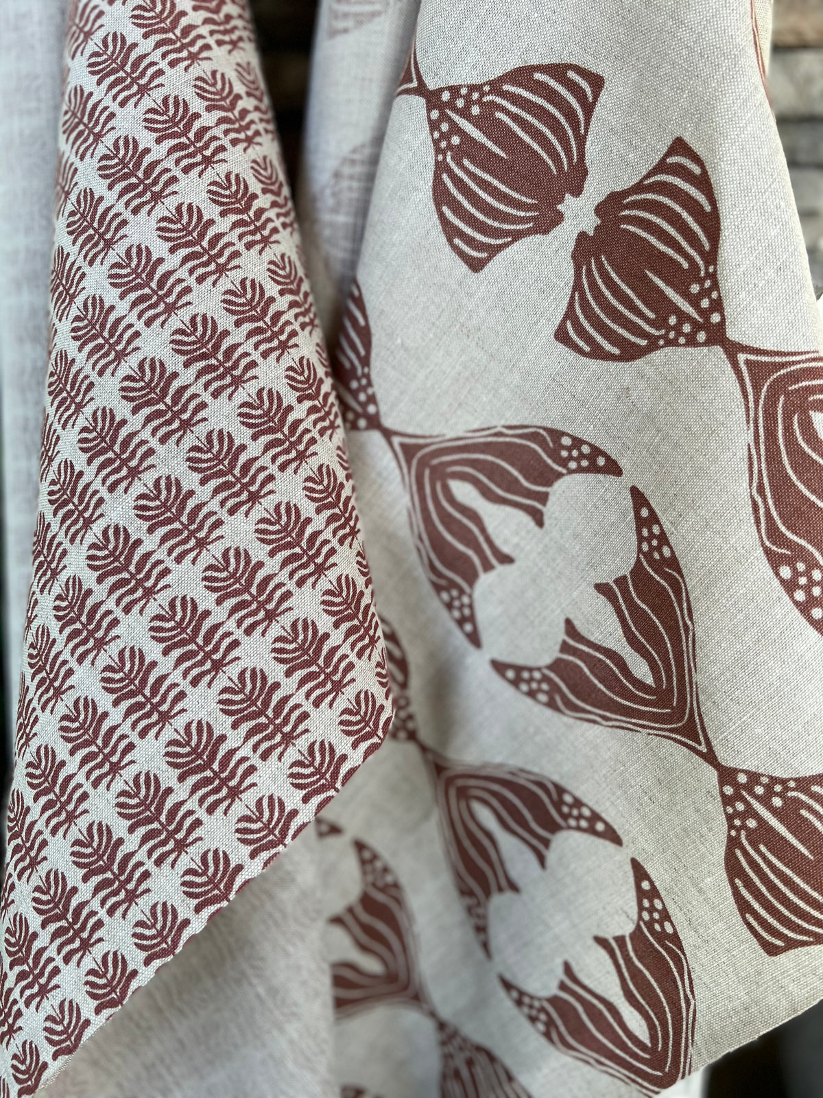 Daphne stripe fabric by Greige Textiles — a modern, organic pattern featuring abstract fishlike forms, hand-printed on Belgian linen for drapery, cushions, or upholstery.