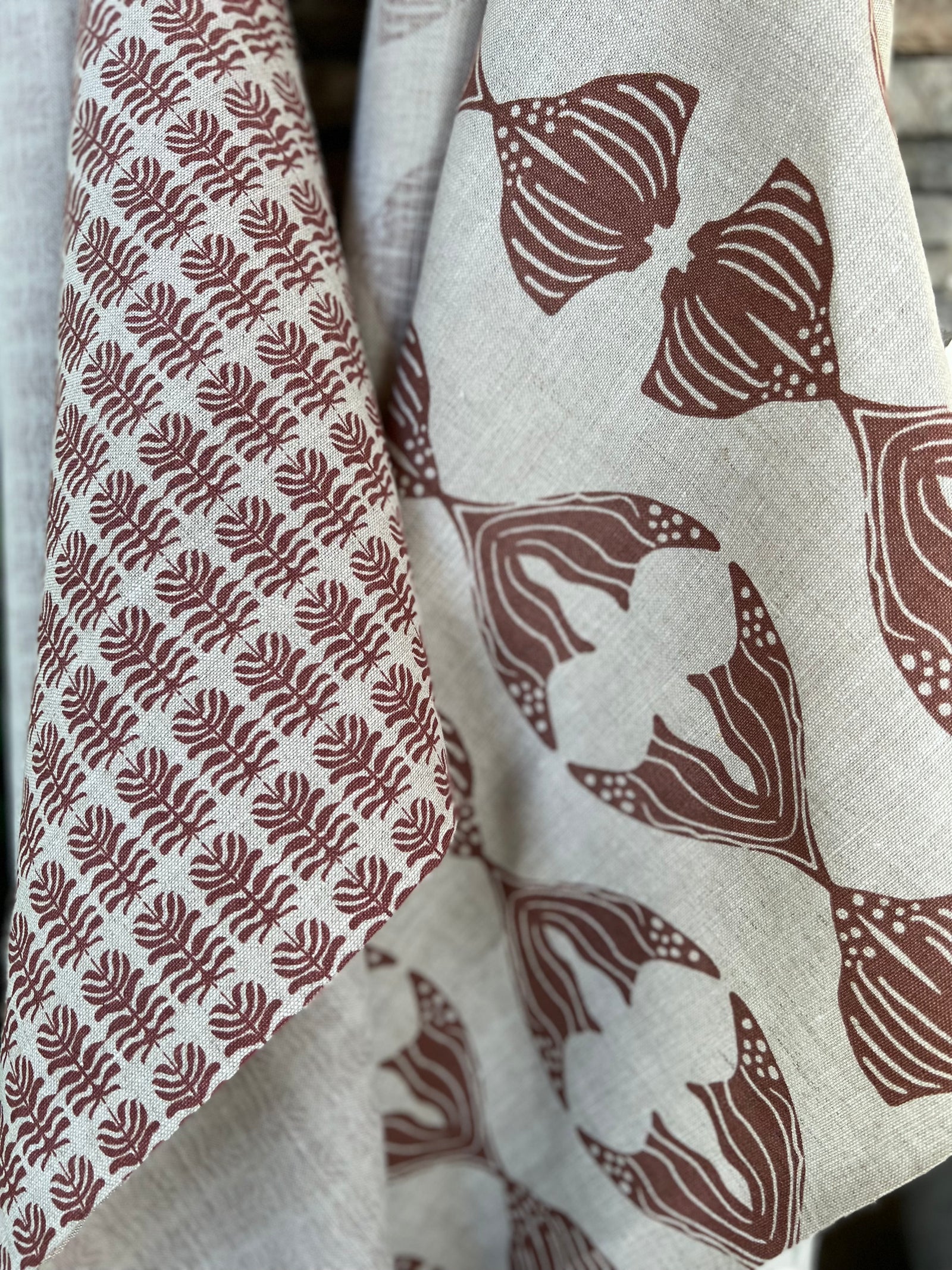 Daphne stripe fabric by Greige Textiles — a modern, organic pattern featuring abstract fishlike forms, hand-printed on Belgian linen for drapery, cushions, or upholstery.