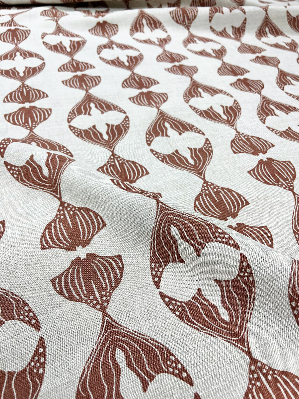 Daphne stripe fabric by Greige Textiles — a modern, organic pattern featuring abstract fishlike forms, hand-printed on Belgian linen for drapery, cushions, or upholstery.